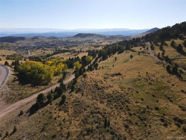 a view of mountains and mountain in the background