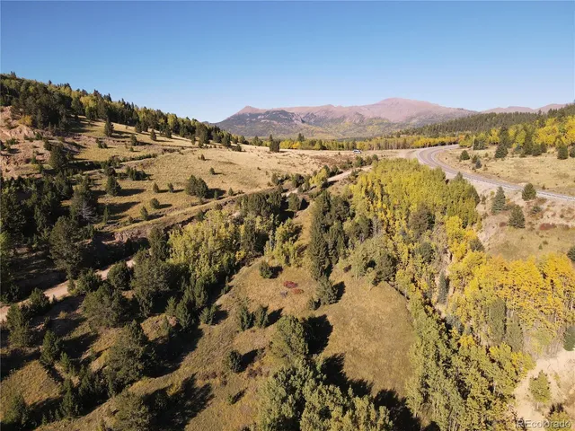 a view of a city with mountains in the background