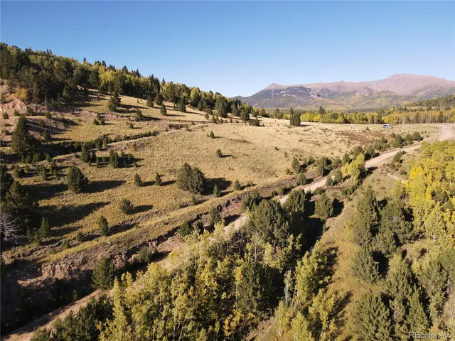a view of a city with mountains in the background