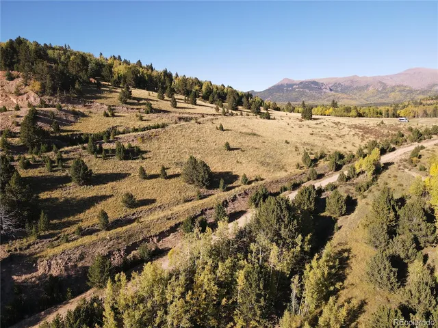 a view of a city with mountains in the background