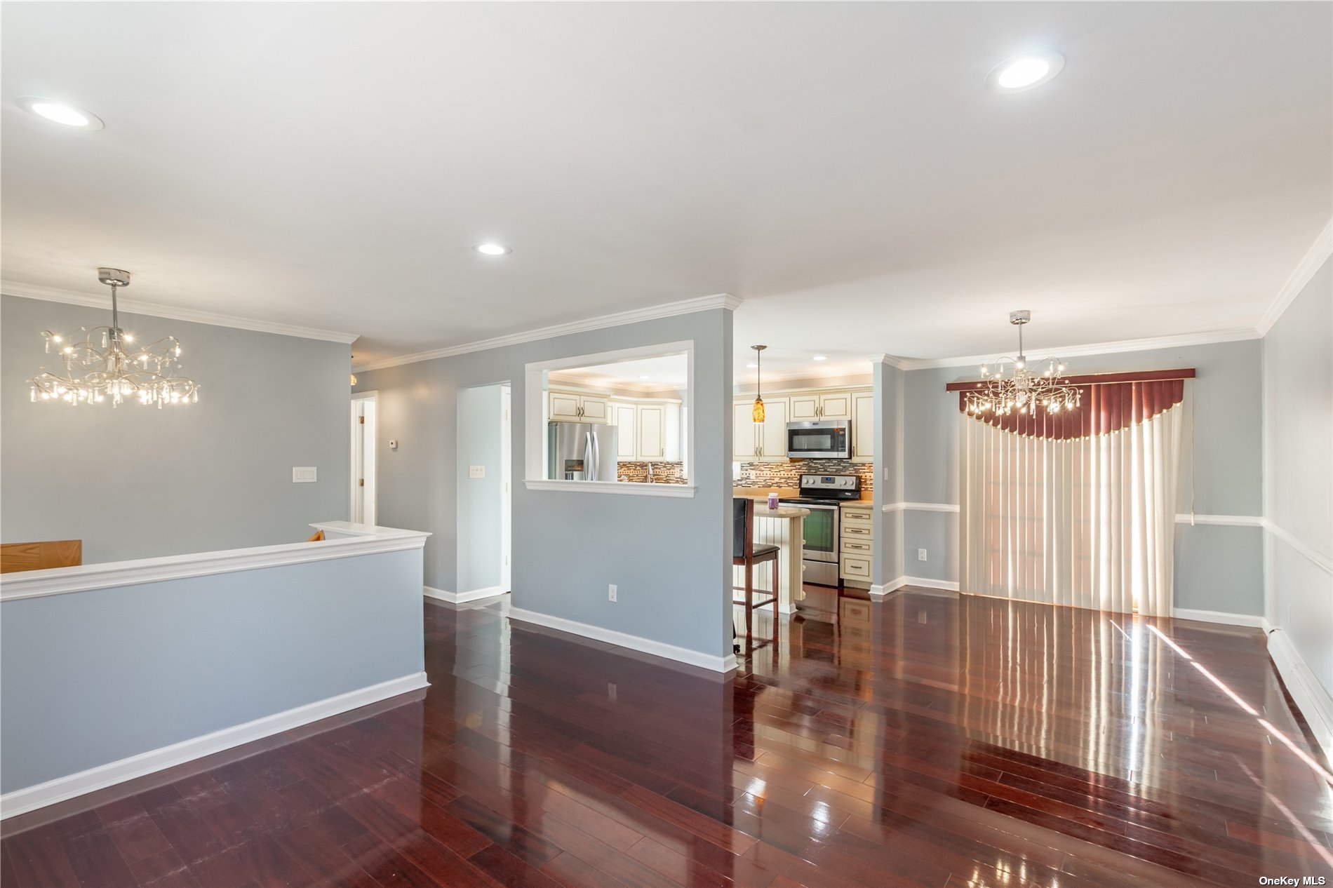 a view of a livingroom with furniture wooden floor and window
