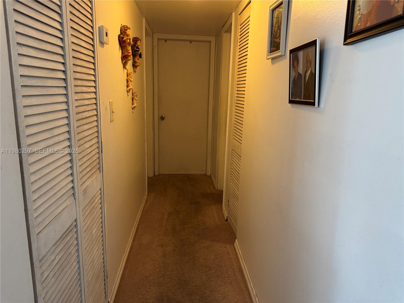 6507 Winfield Boulevard, Unit 111AC Margate, FL 33063 - Photo 15 of 42 a view of a hallway