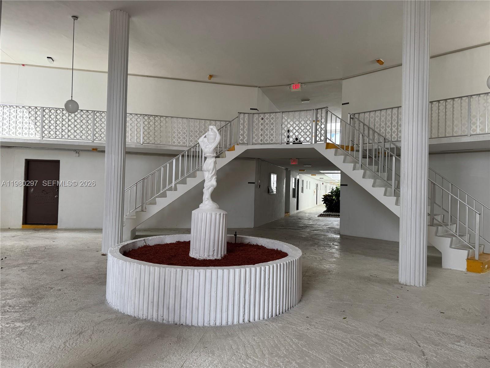 6507 Winfield Boulevard, Unit 111AC Margate, FL 33063 - Photo 2 of 42 a living room with furniture and a table