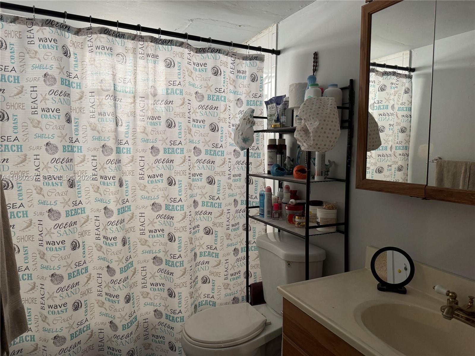 6507 Winfield Boulevard, Unit 111AC Margate, FL 33063 - Photo 25 of 42 a bathroom with a sink toilet and shower