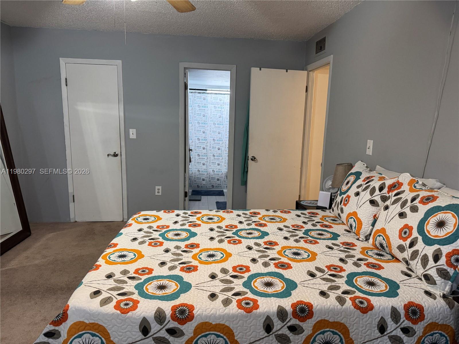 6507 Winfield Boulevard, Unit 111AC Margate, FL 33063 - Photo 34 of 42 a bedroom with a bed and a window