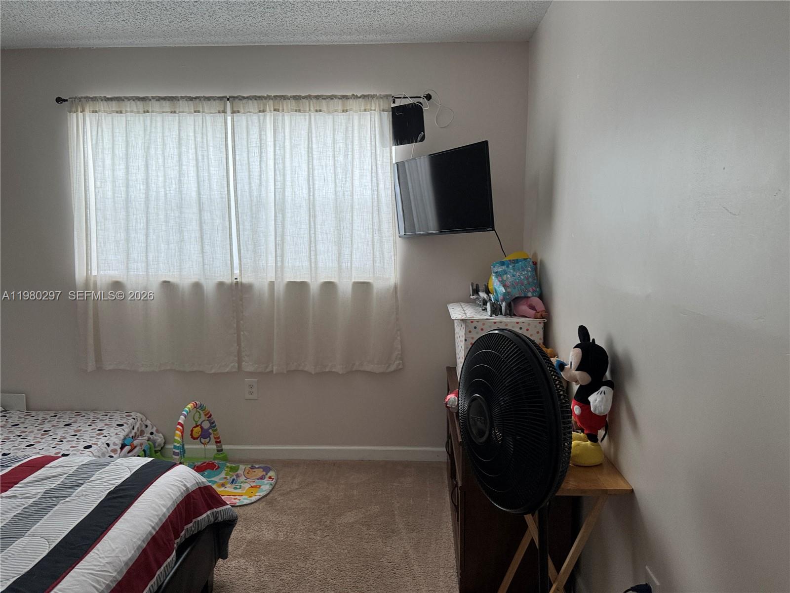 6507 Winfield Boulevard, Unit 111AC Margate, FL 33063 - Photo 40 of 42 a view of a workspace with furniture and a window
