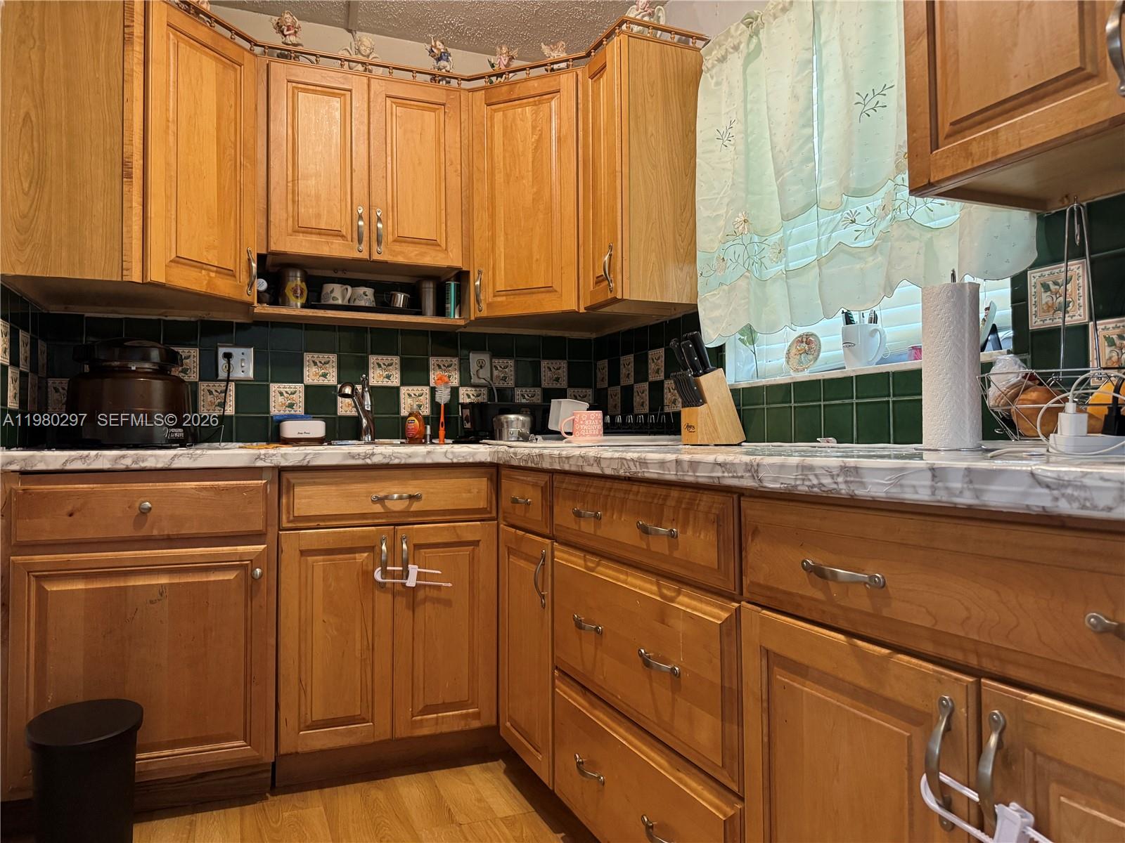 6507 Winfield Boulevard, Unit 111AC Margate, FL 33063 - Photo 8 of 42 a kitchen with stainless steel appliances granite countertop a sink and a cabinets
