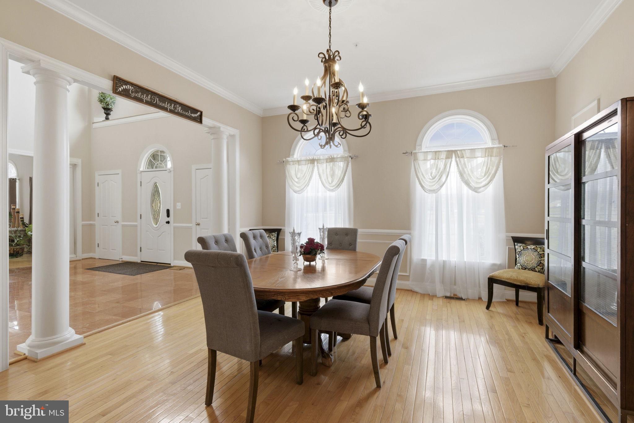 15611 Riding Stable Road Laurel, MD 20707 - Photo 20 of 86 a view of a dining room with furniture window and wooden floor