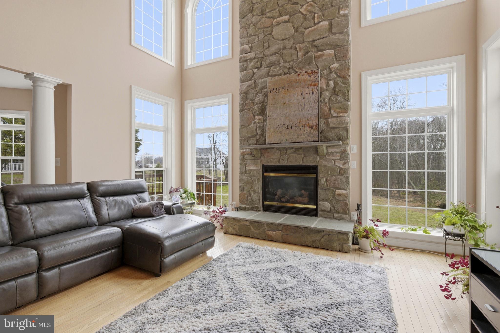 15611 Riding Stable Road Laurel, MD 20707 - Photo 30 of 86 a living room with furniture and a fireplace