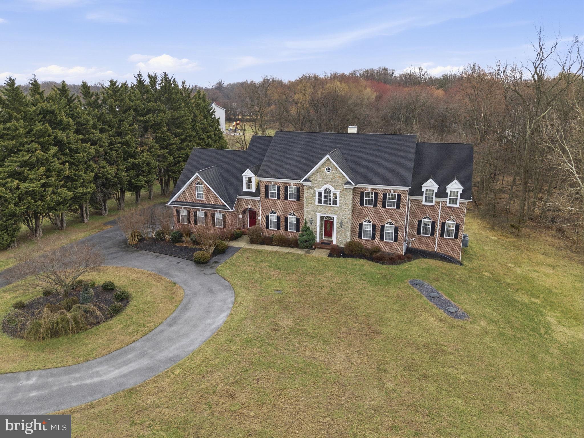 15611 Riding Stable Road Laurel, MD 20707 - Photo 3 of 86 a view of a house with a big yard next to a road