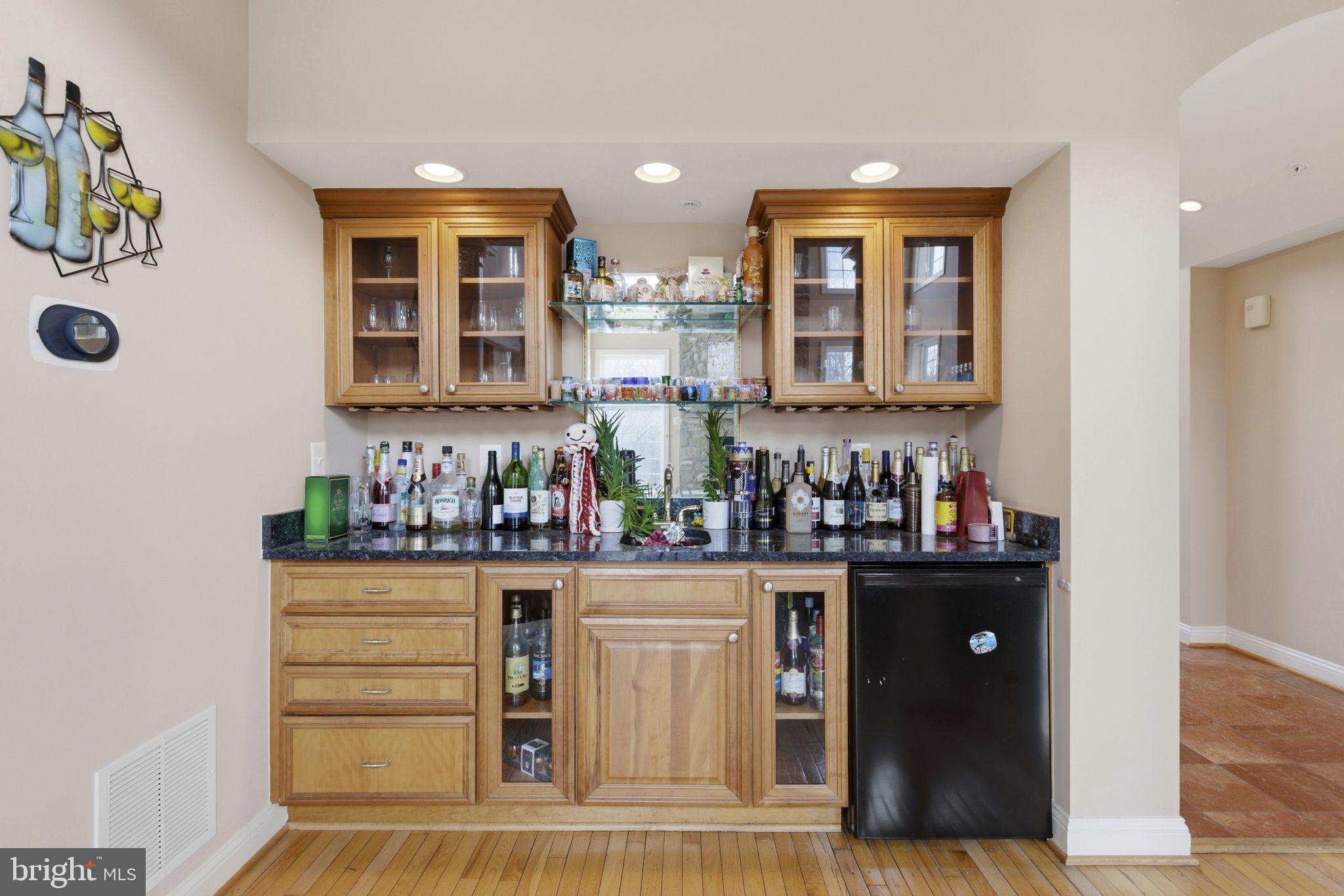 15611 Riding Stable Road Laurel, MD 20707 - Photo 34 of 86 a view of a kitchen with stainless steel appliances granite countertop a refrigerator and a stove top oven