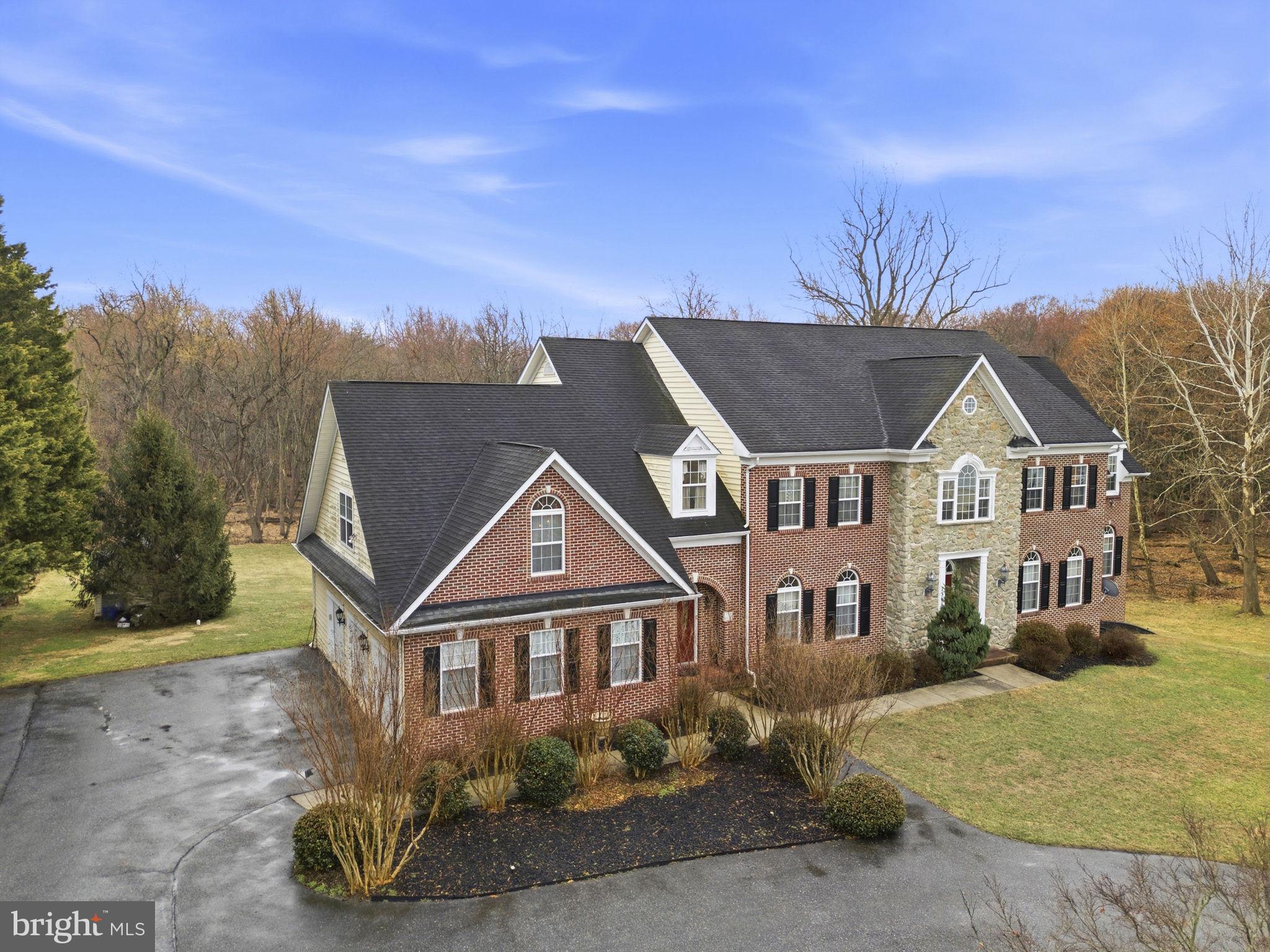15611 Riding Stable Road Laurel, MD 20707 - Photo 4 of 86 front view of a house with a yard
