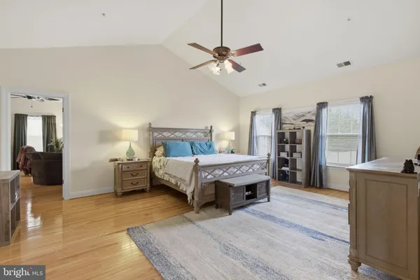 a living room with furniture and a lamp