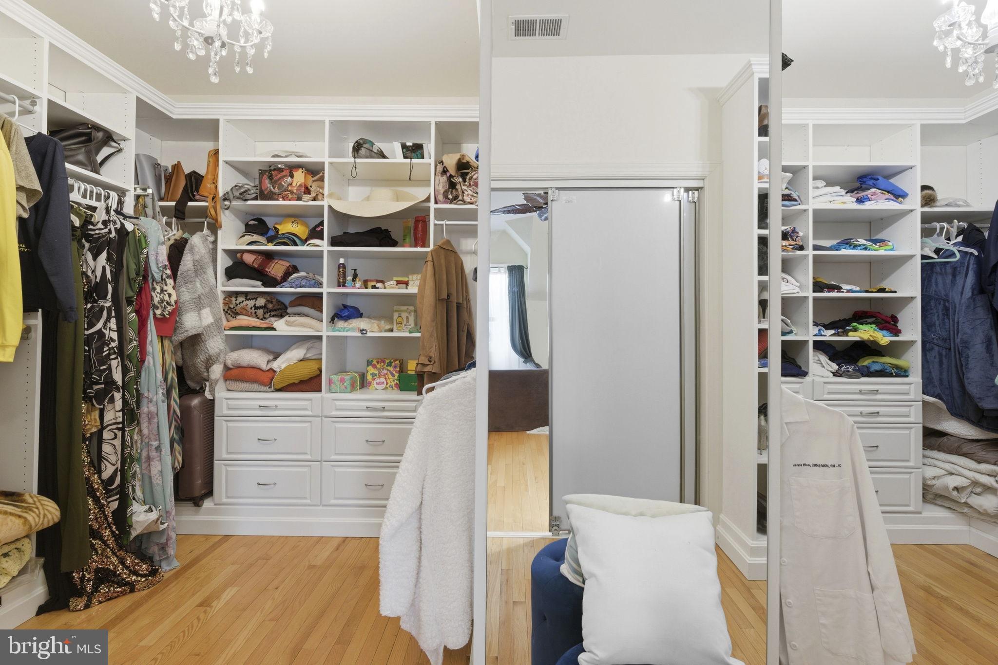 15611 Riding Stable Road Laurel, MD 20707 - Photo 44 of 86 a view of walk in closet with clothes and shoes