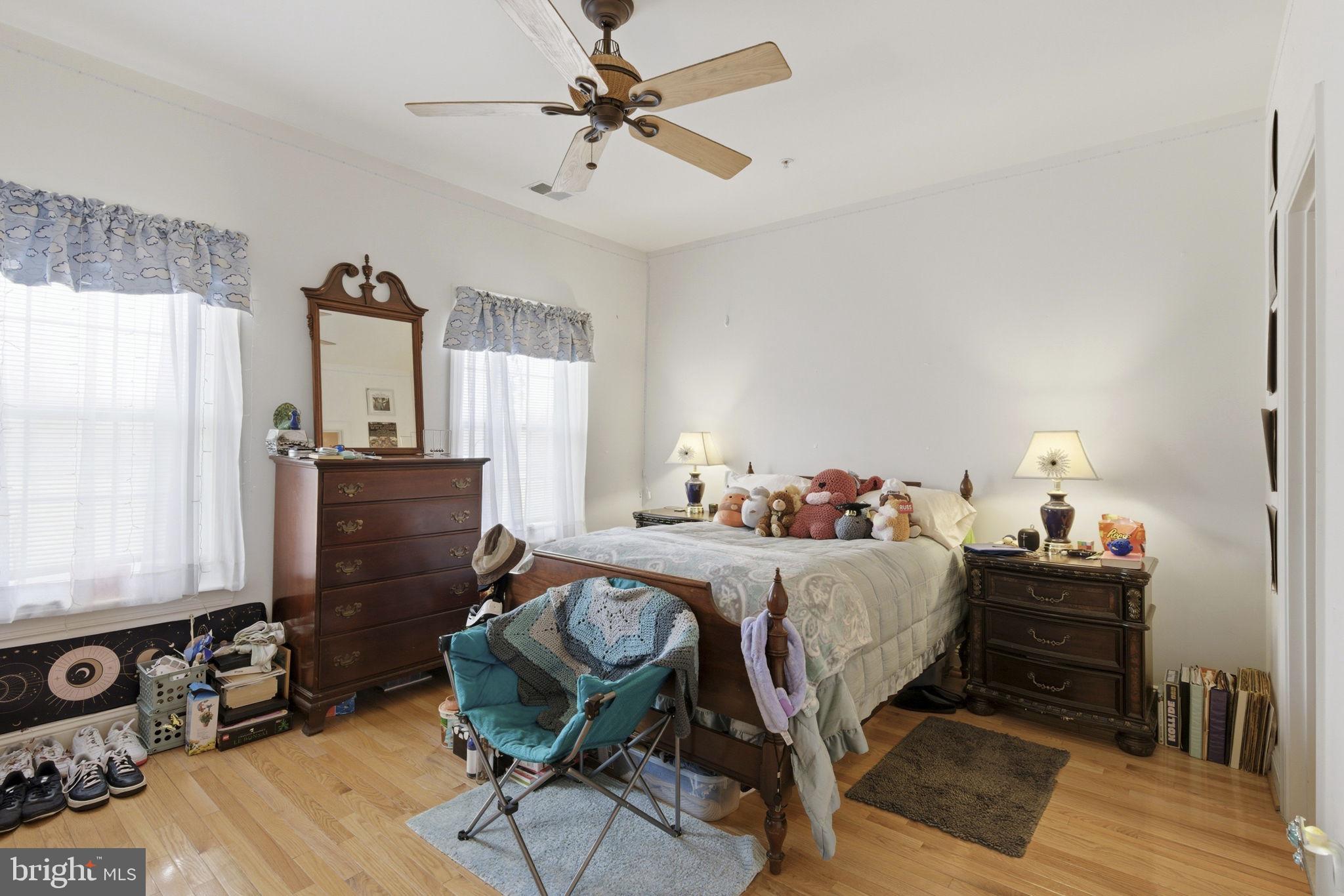 15611 Riding Stable Road Laurel, MD 20707 - Photo 50 of 86 a bedroom with a bed and wooden floor