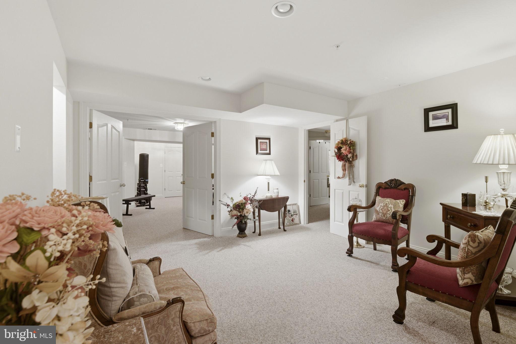 15611 Riding Stable Road Laurel, MD 20707 - Photo 63 of 86 a living room with furniture and a fireplace