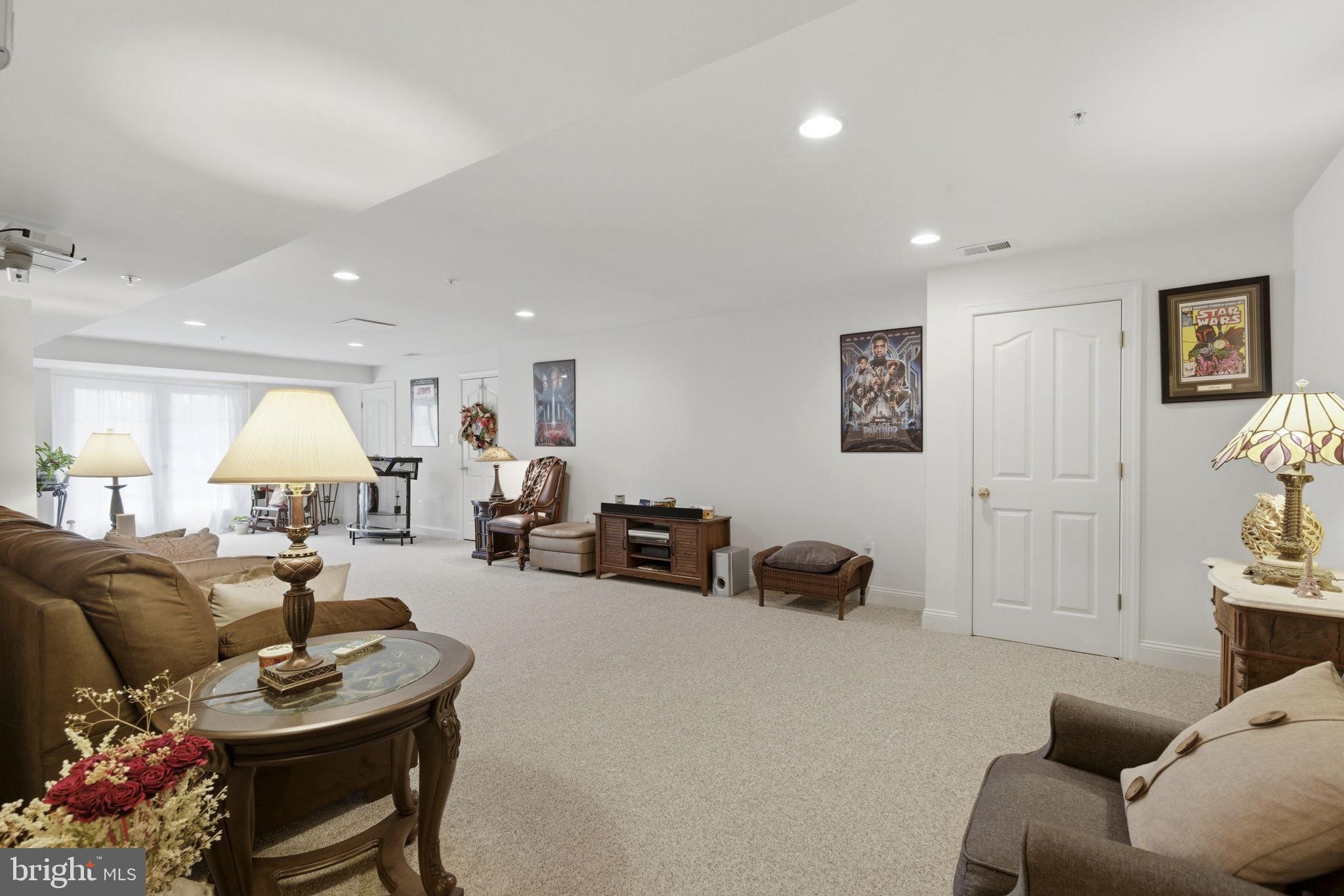 15611 Riding Stable Road Laurel, MD 20707 - Photo 64 of 86 a living room with furniture and a lamp