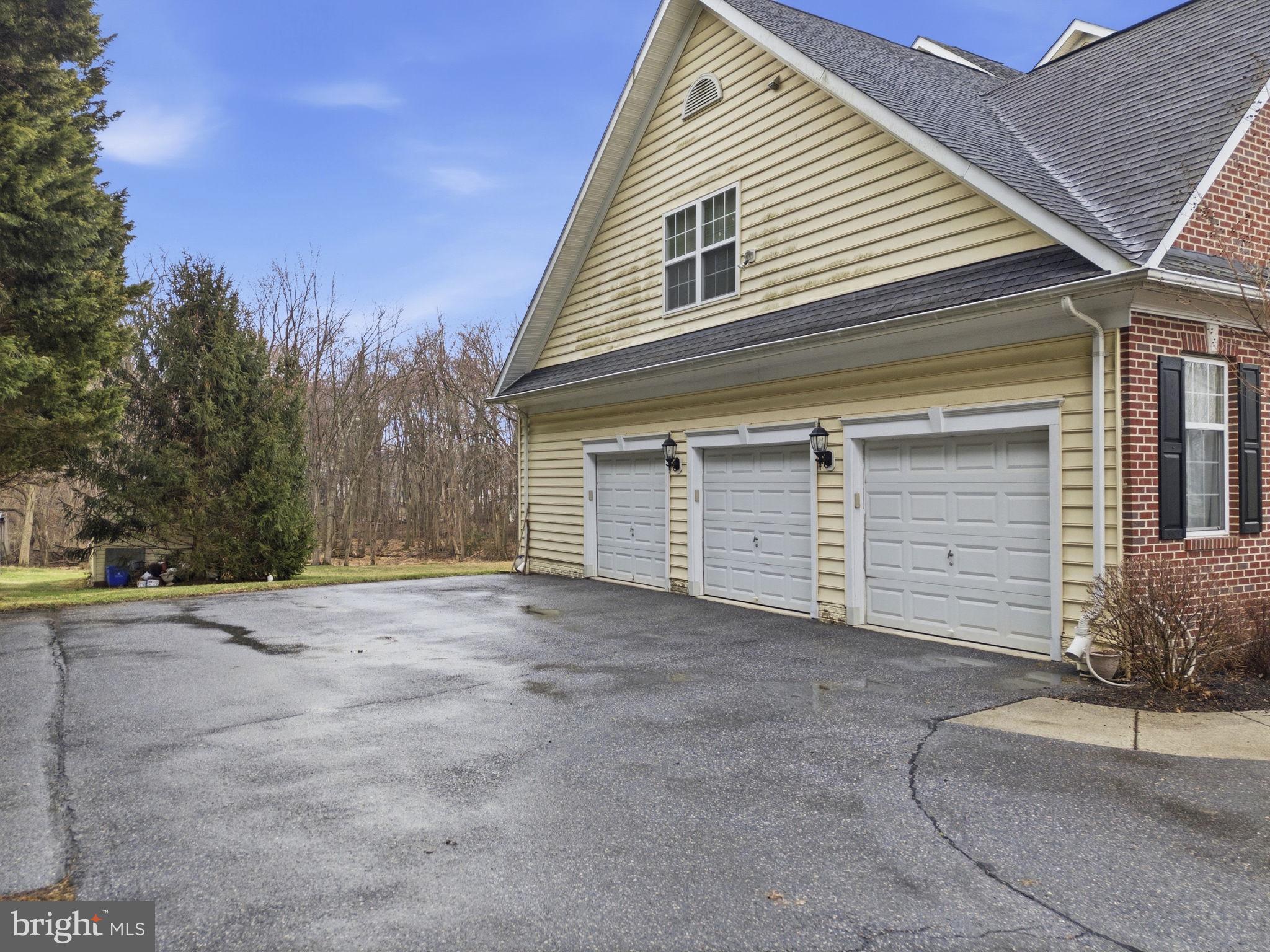 15611 Riding Stable Road Laurel, MD 20707 - Photo 75 of 86 a view of a house with a yard and garage