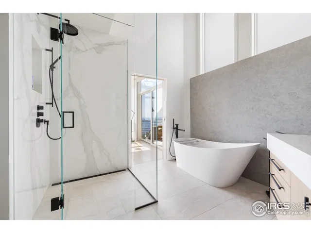 a bathroom with a bathtub and shower