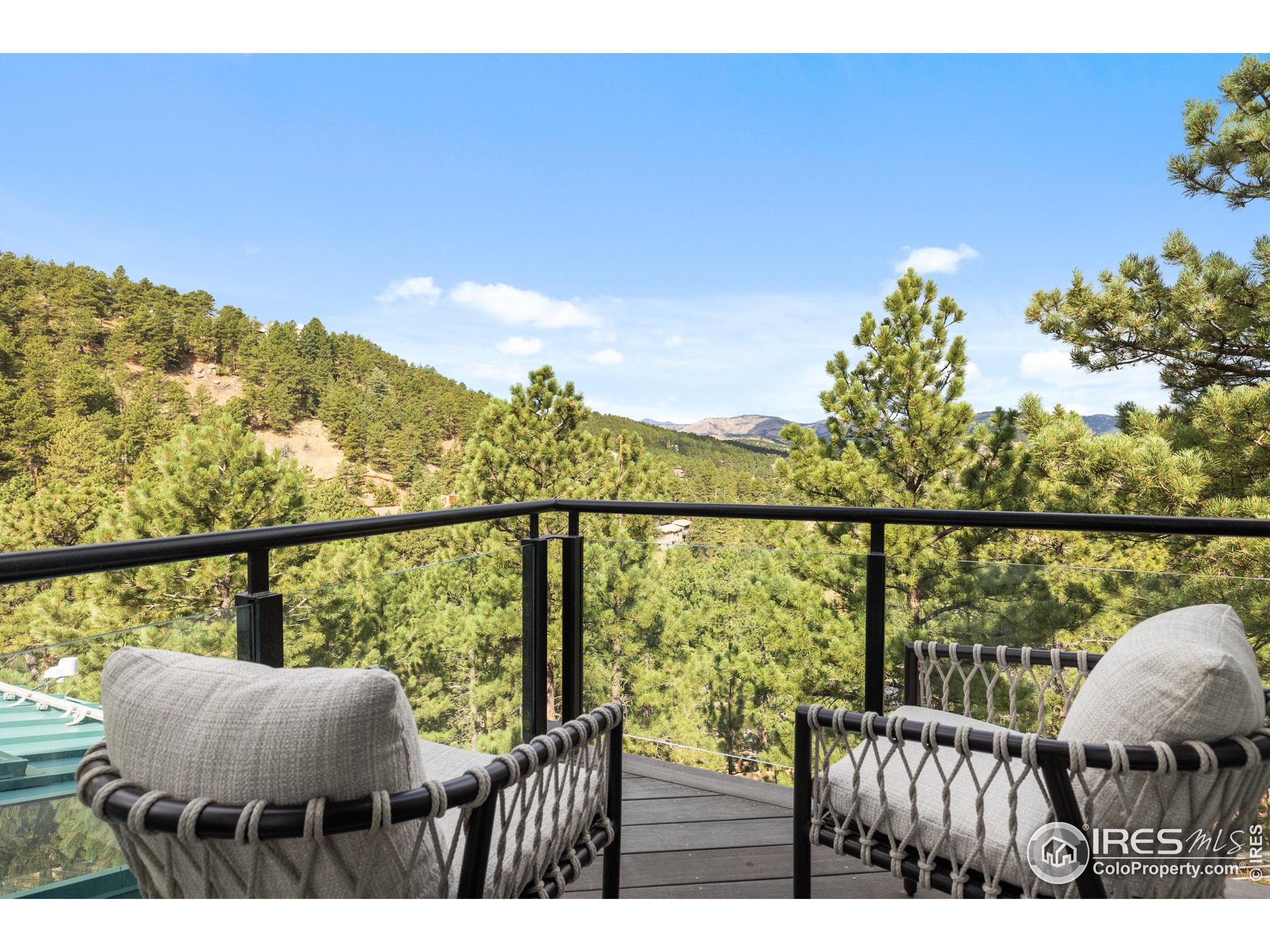 1145 Timber Lane Boulder, CO 80304 - Photo 23 of 40 a view of a balcony with wooden floor and outdoor seating