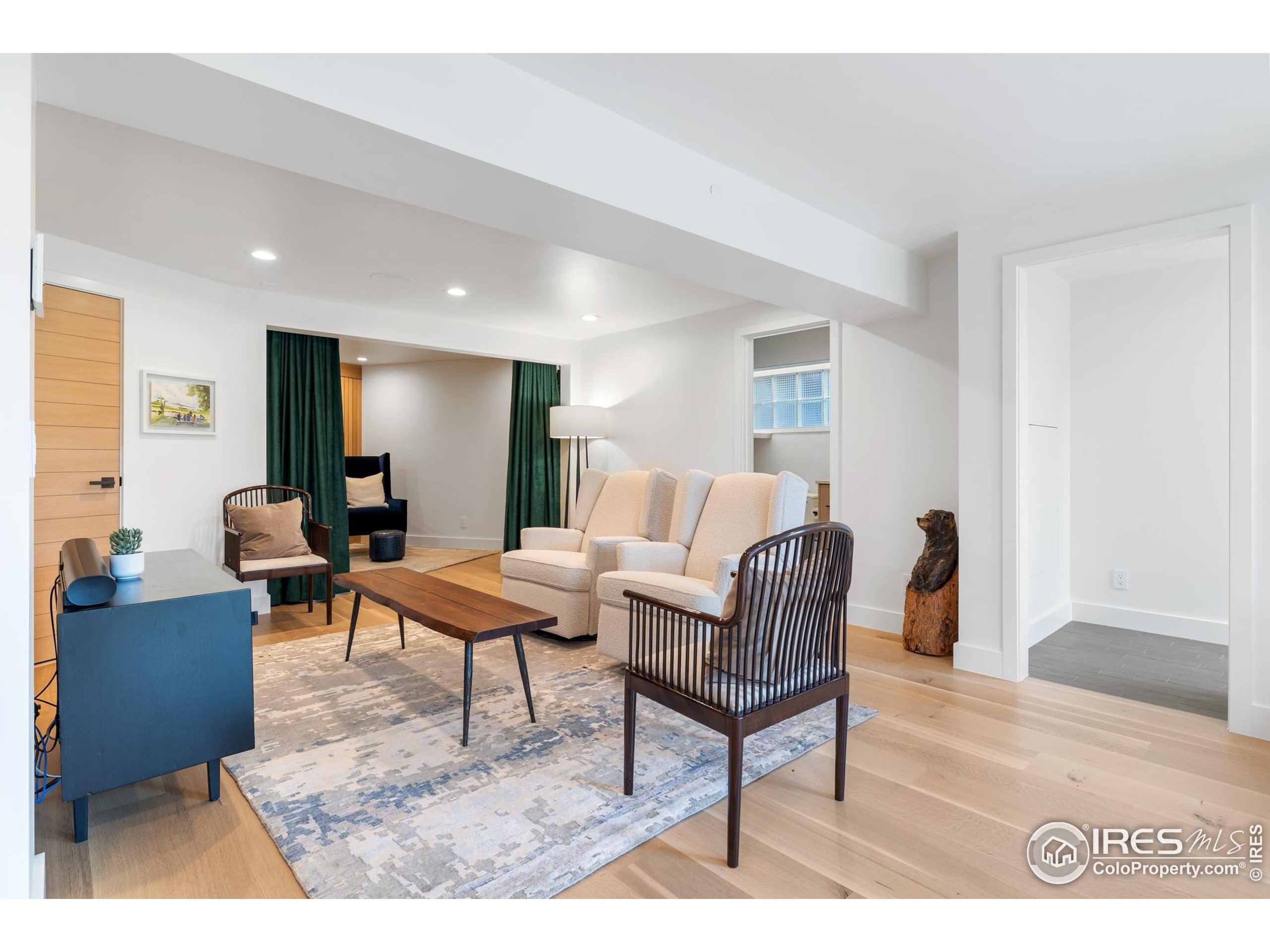 1145 Timber Lane Boulder, CO 80304 - Photo 27 of 40 a living room with furniture and a wooden floor