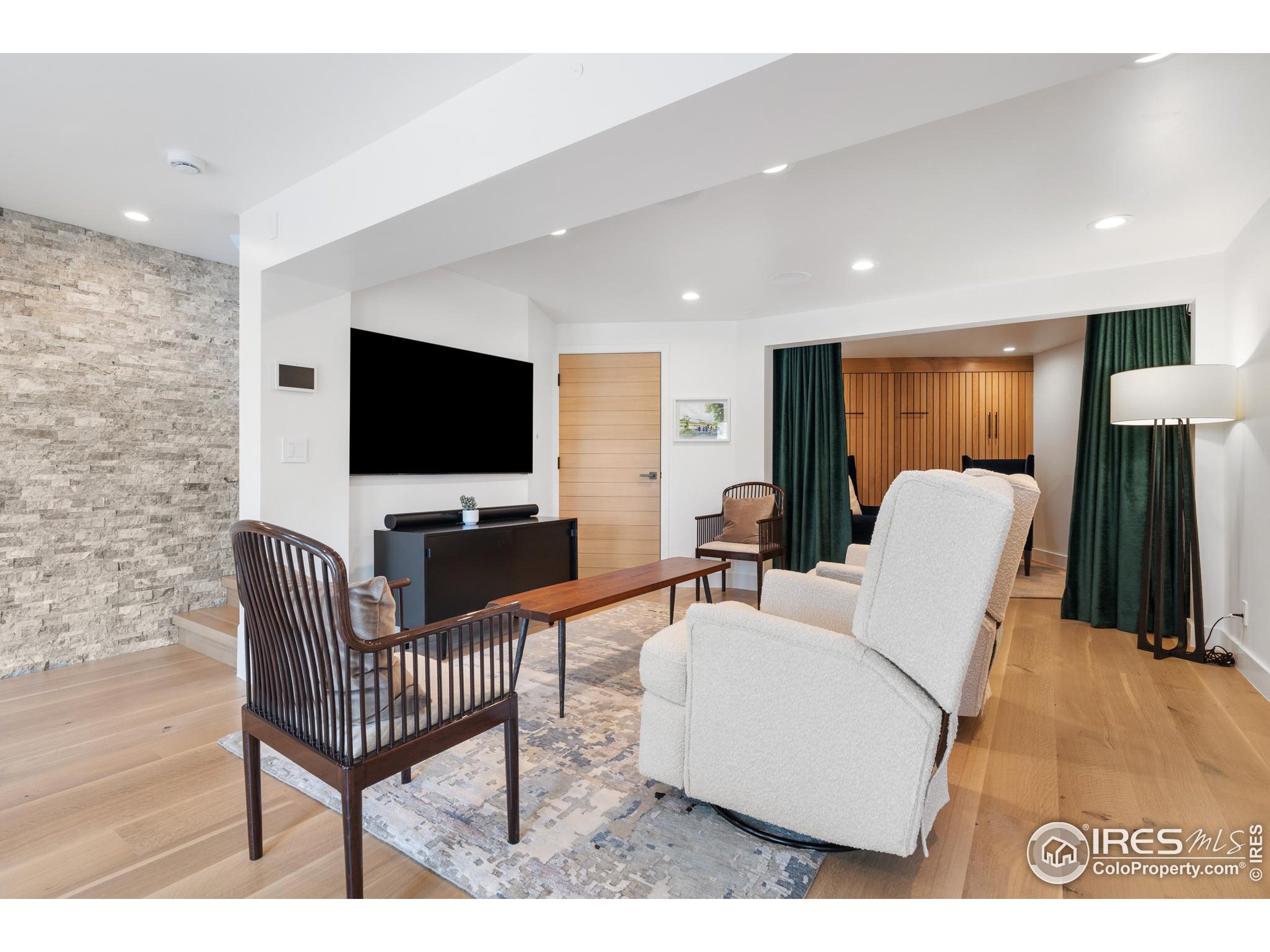 1145 Timber Lane Boulder, CO 80304 - Photo 28 of 40 a living room with furniture and a flat screen tv