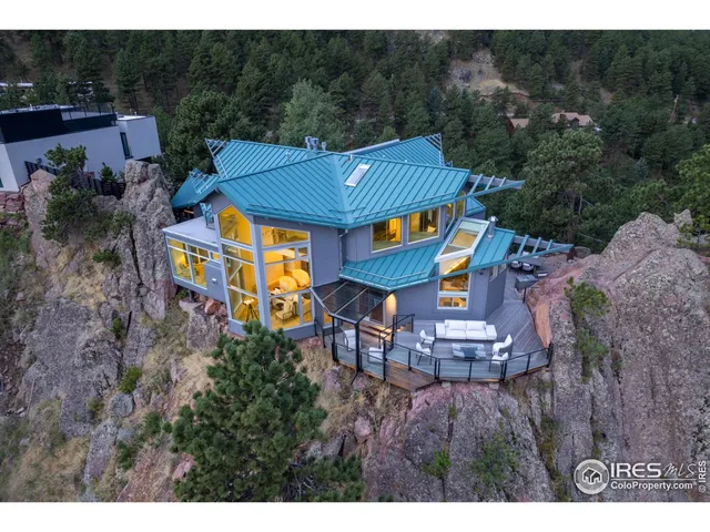 a aerial view of a house with a yard