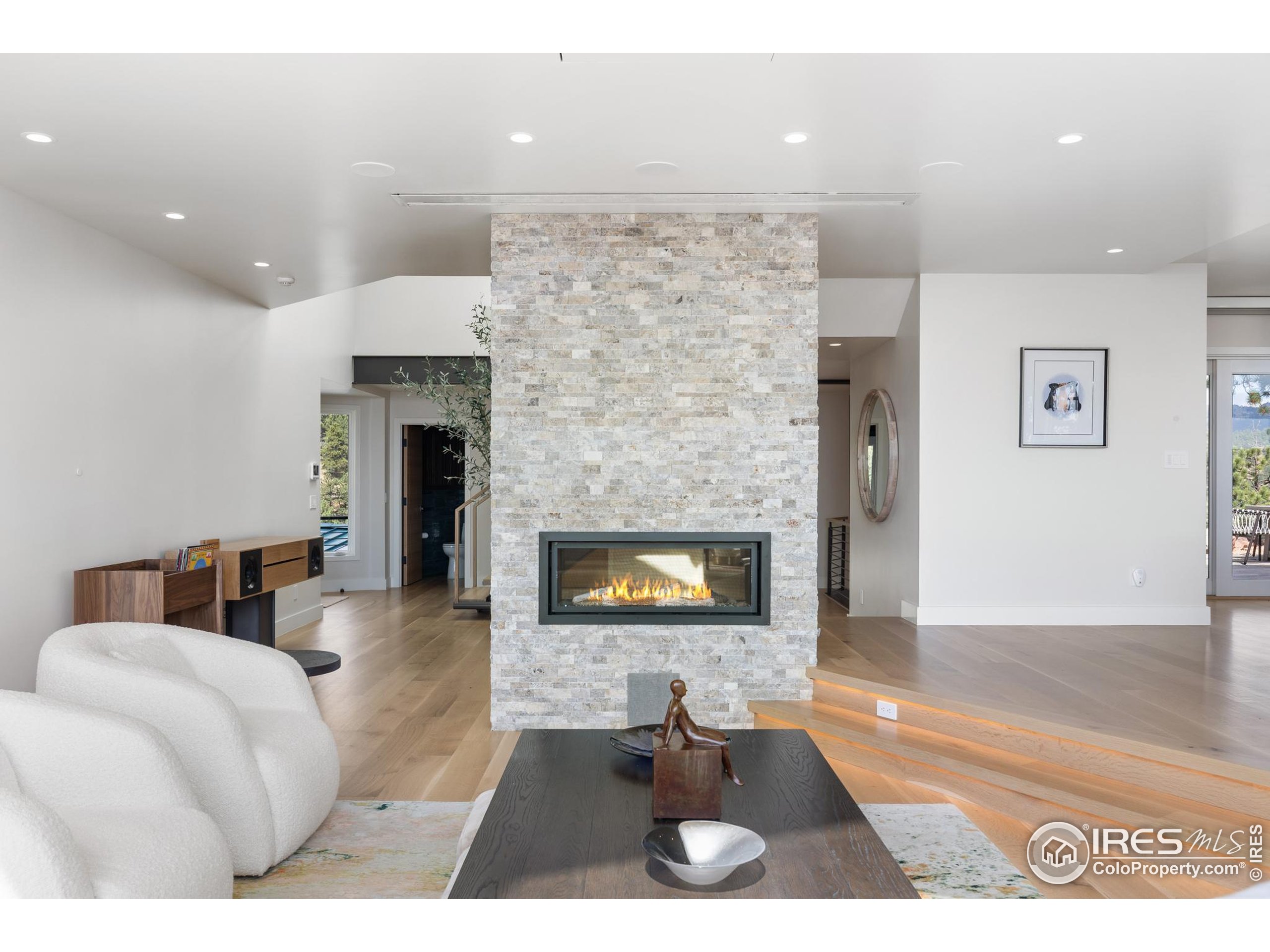 1145 Timber Lane Boulder, CO 80304 - Photo 4 of 40 a living room with furniture and a fireplace