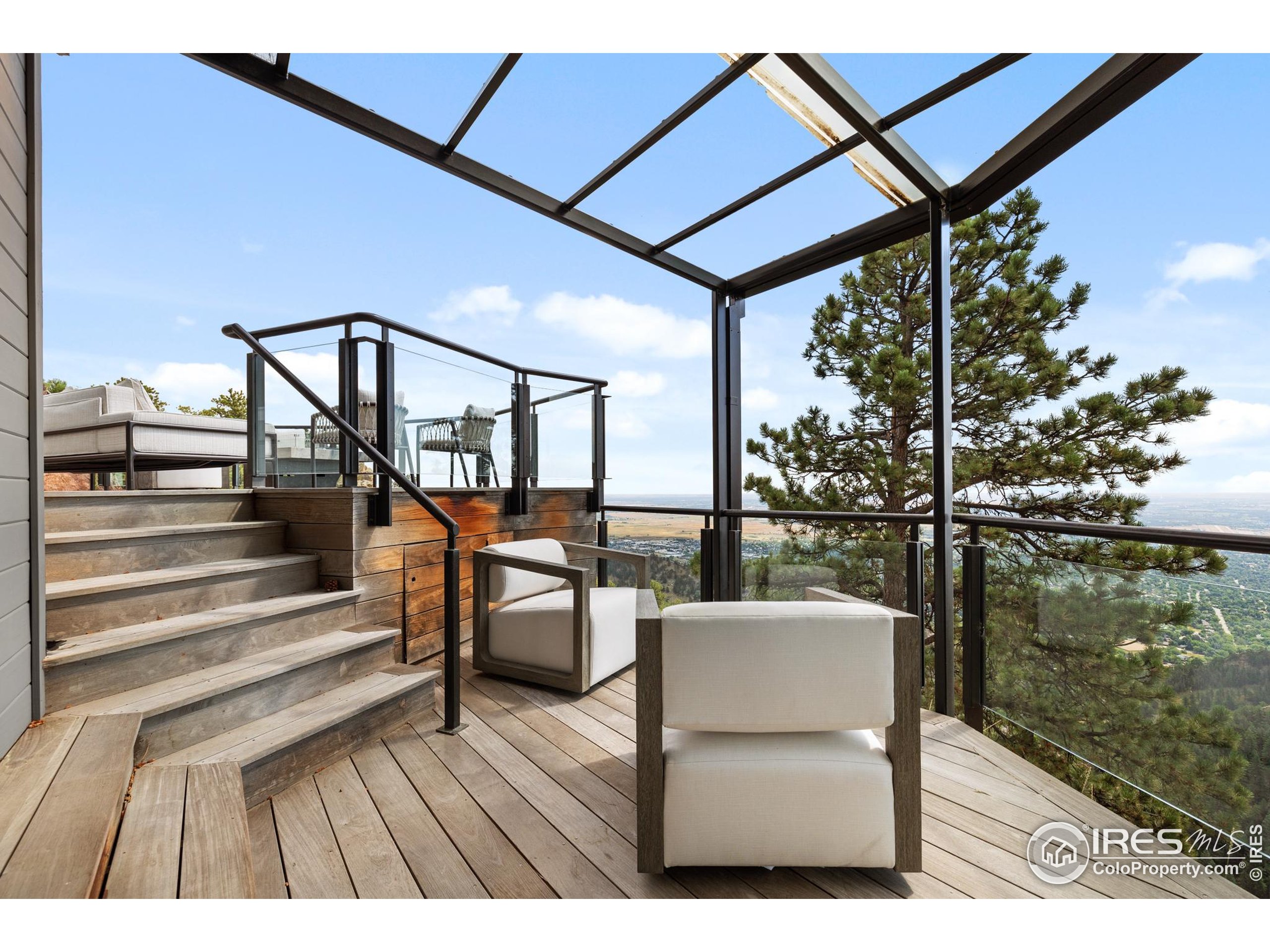 1145 Timber Lane Boulder, CO 80304 - Photo 10 of 40 a view of a balcony with chairs