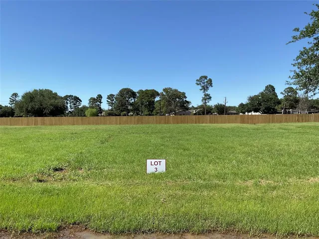 a view of a field with an ocean view