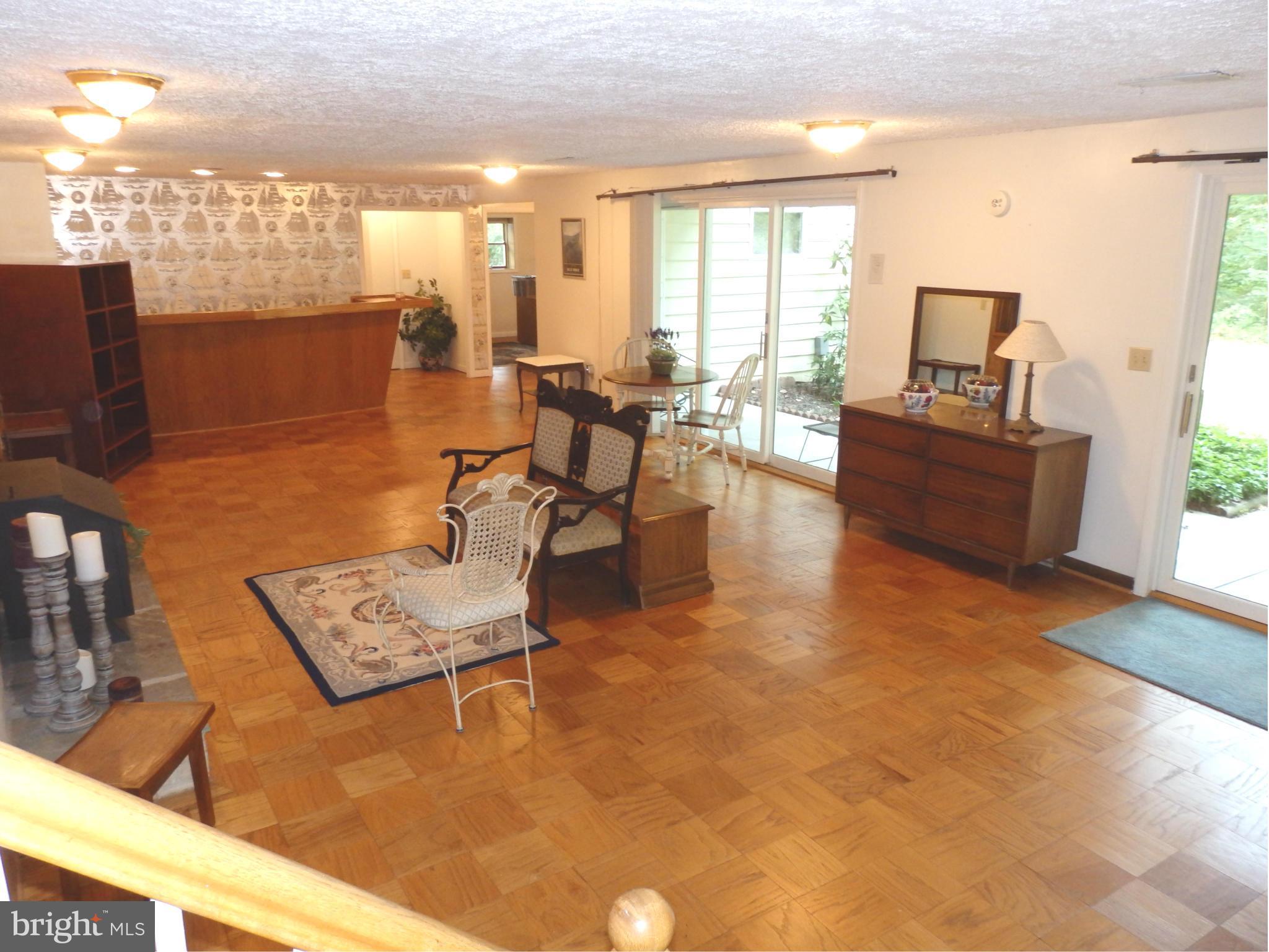 5512 Woodlyn Road Frederick, MD 21703 - Photo 22 of 30 Large LL family room has sliders to patio and back