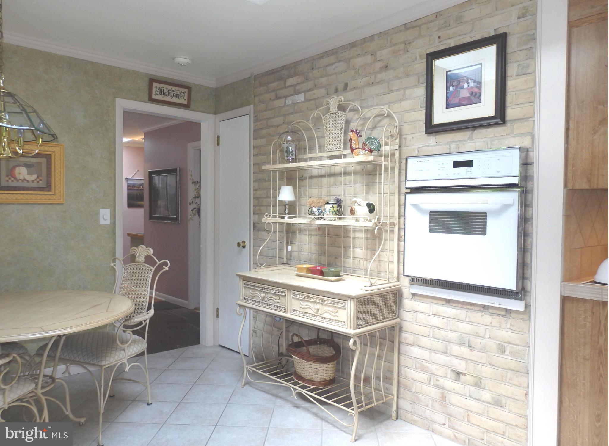 5512 Woodlyn Road Frederick, MD 21703 - Photo 4 of 30 Brick accent wall in skylit kitchen
