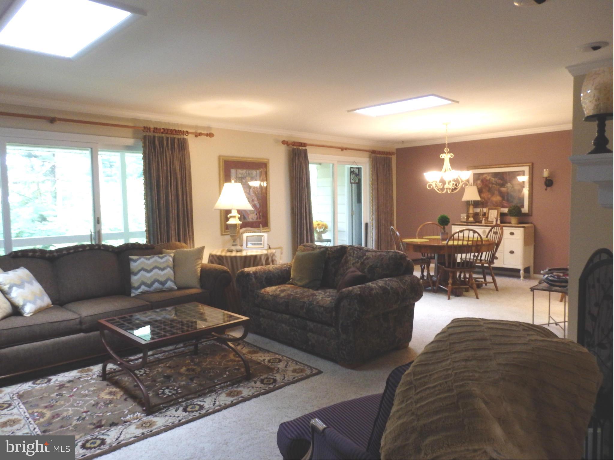 5512 Woodlyn Road Frederick, MD 21703 - Photo 7 of 30 Living Room and dining room with skylights