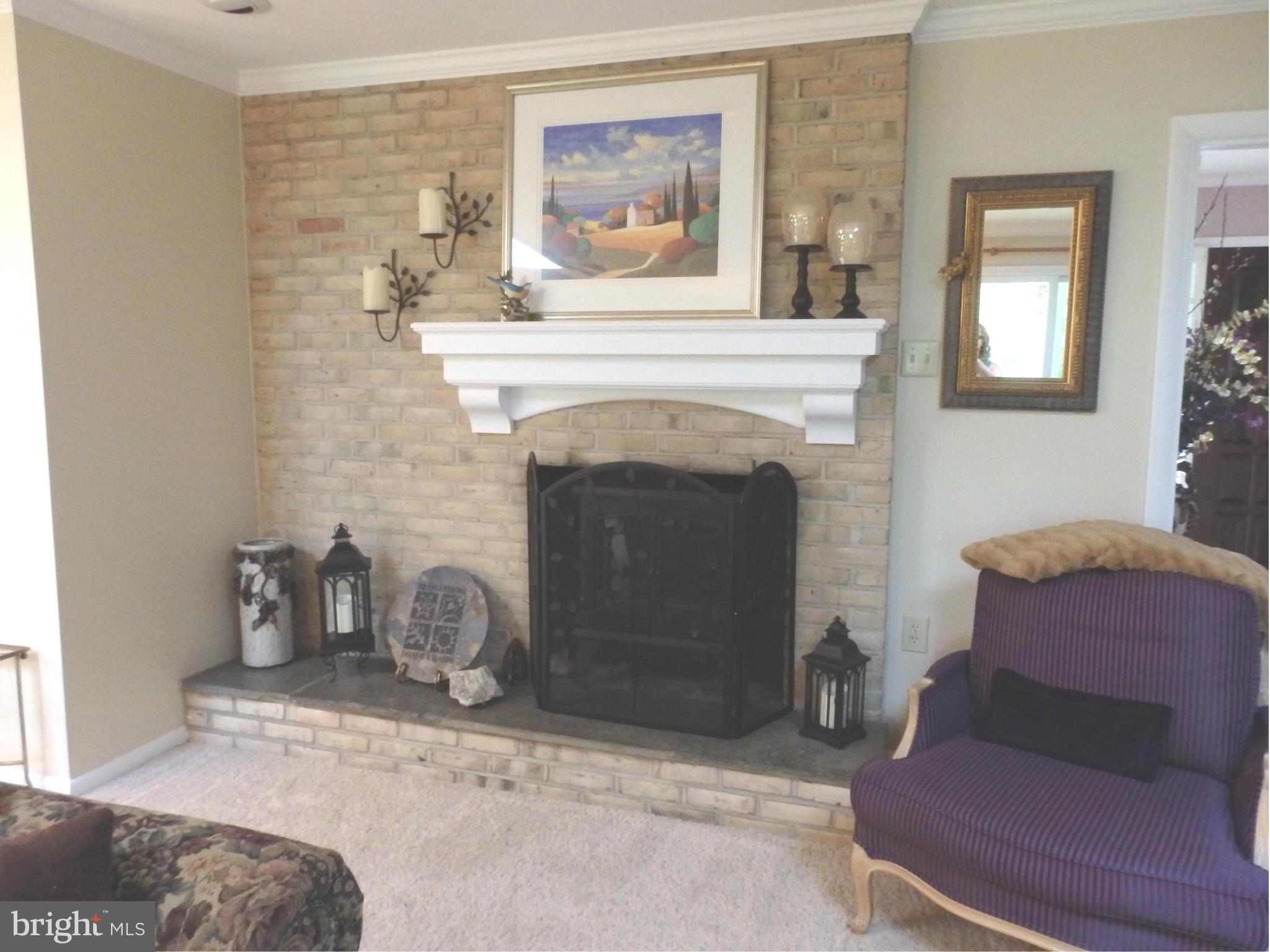 5512 Woodlyn Road Frederick, MD 21703 - Photo 9 of 30 Living Room has woodburning fireplace