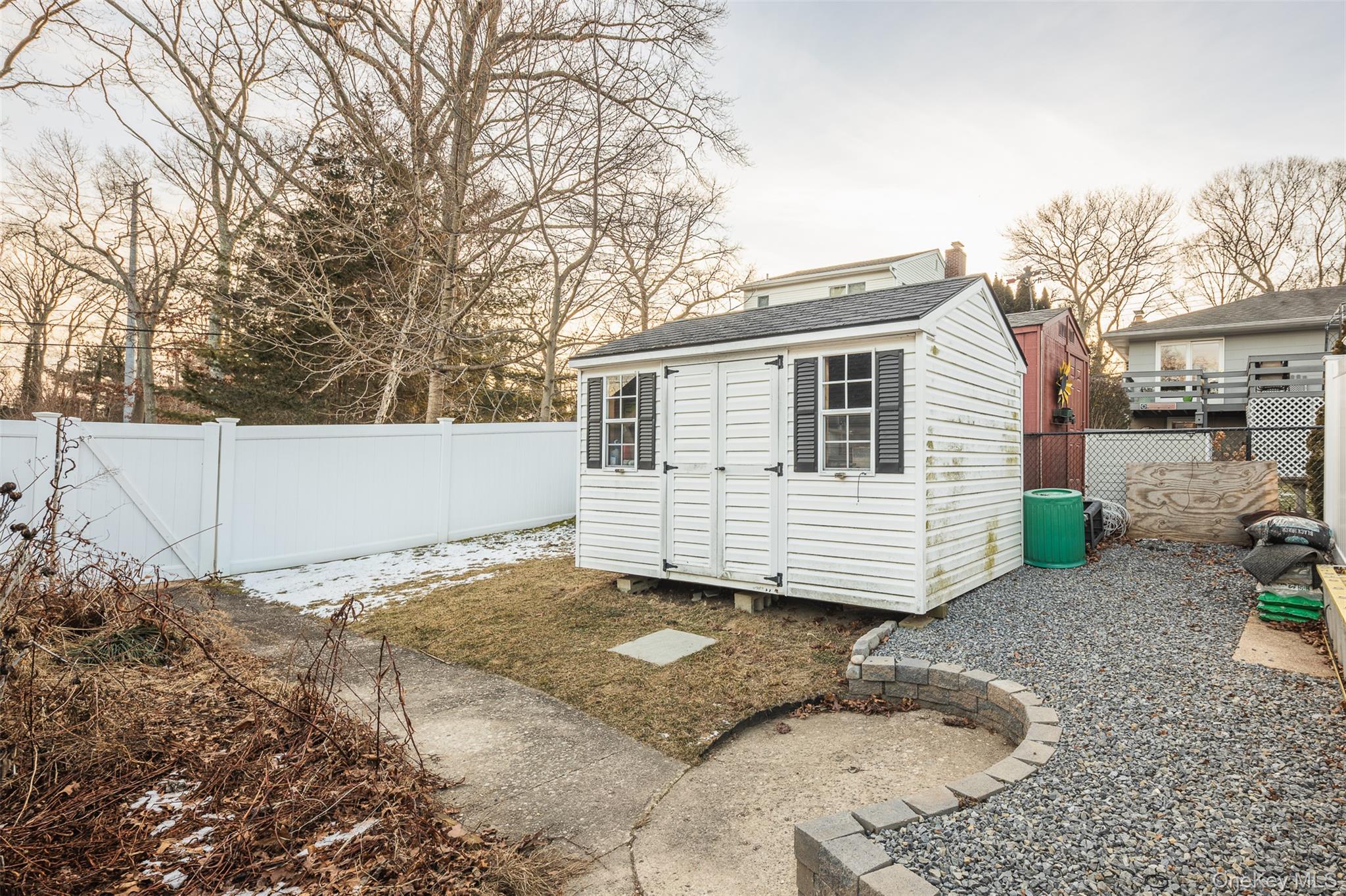 3 Cedar Road Sound Beach, NY 11789 - Photo 11 of 14 a view of a backyard with plants and large tree