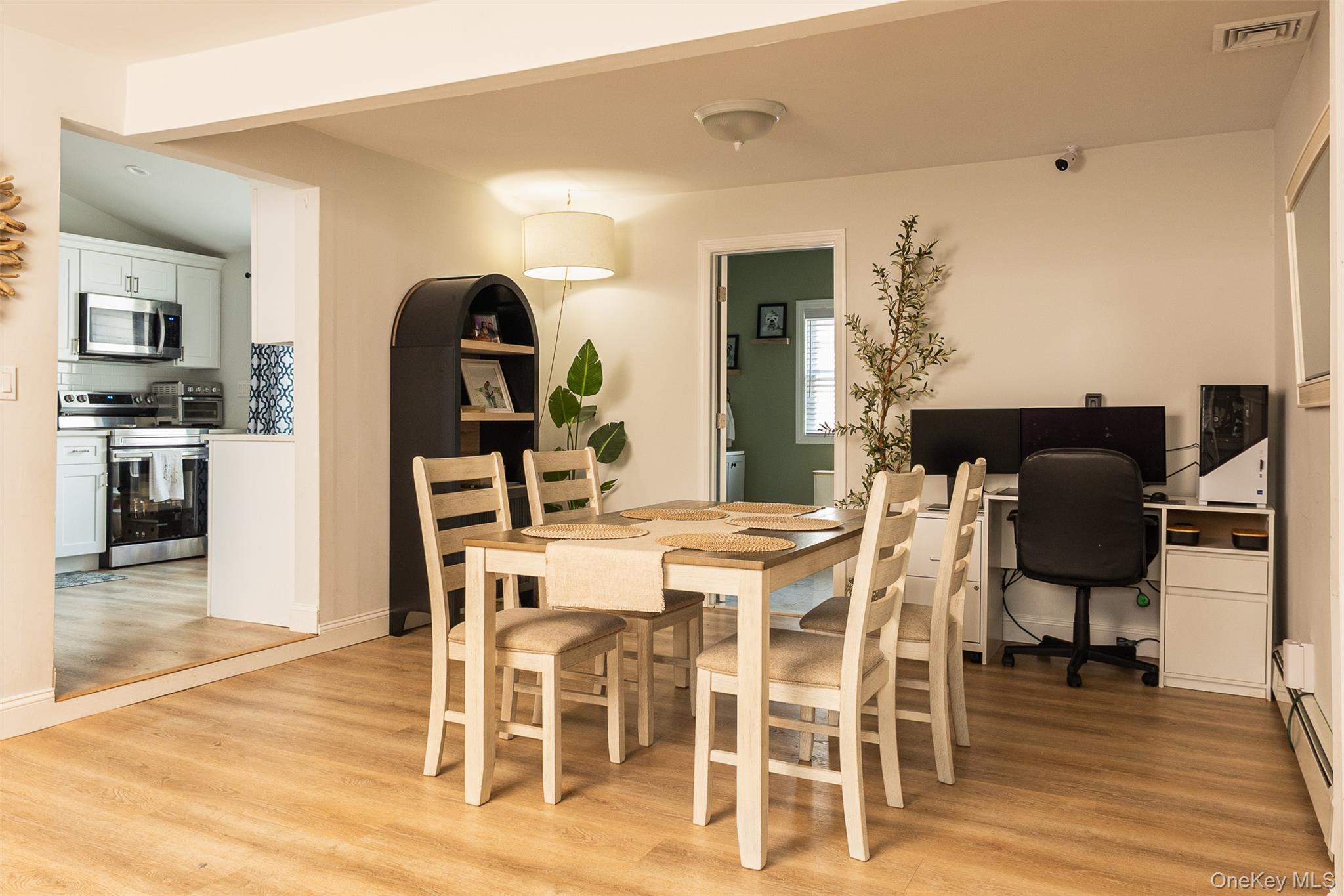3 Cedar Road Sound Beach, NY 11789 - Photo 3 of 14 a dining room with furniture a rug and wooden floor