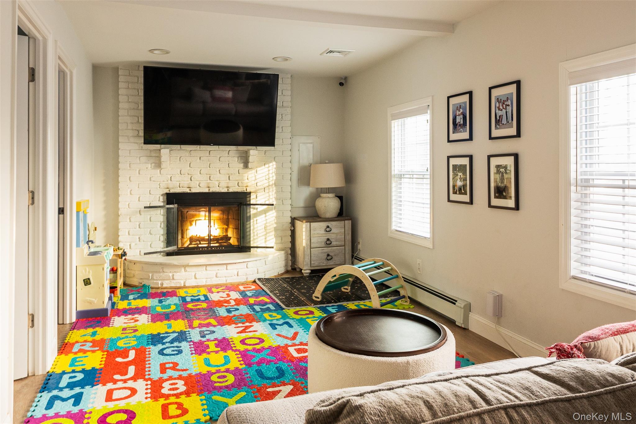 3 Cedar Road Sound Beach, NY 11789 - Photo 4 of 14 a living room with furniture and a flat screen tv