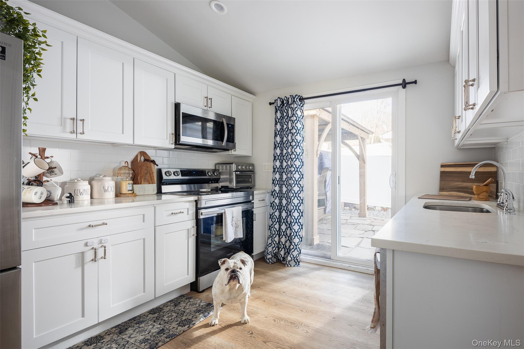 3 Cedar Road Sound Beach, NY 11789 - Photo 5 of 14 a kitchen with a refrigerator stove and sink