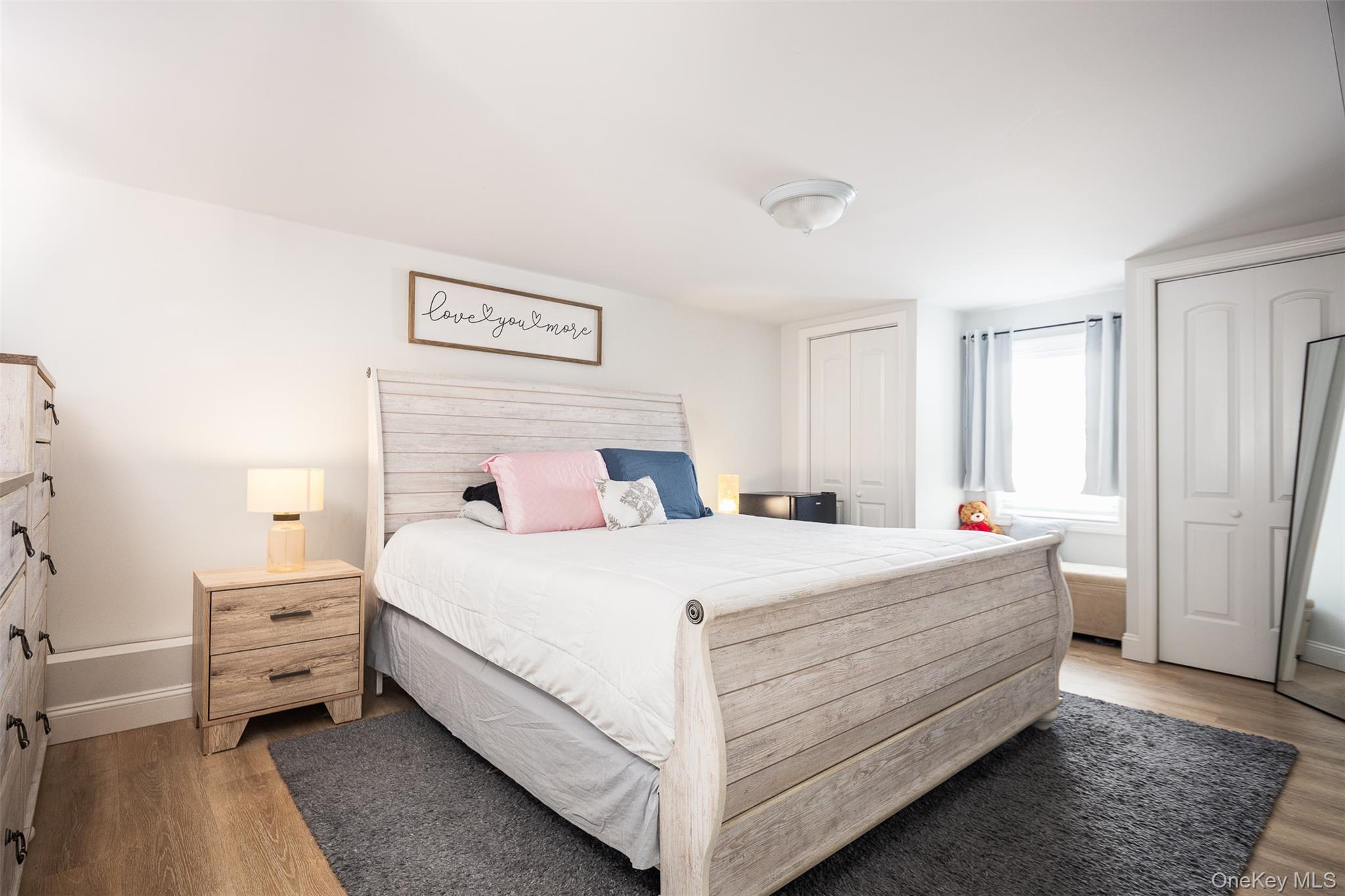 3 Cedar Road Sound Beach, NY 11789 - Photo 6 of 14 a bedroom with a bed and a dresser