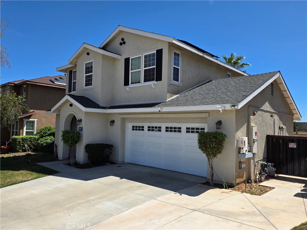 20329 Red Poppy Lane Riverside, CA 92508 - Photo 1 of 24 a front view of a house with a garage