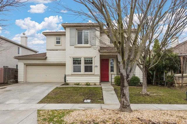 front view of a house with a yard