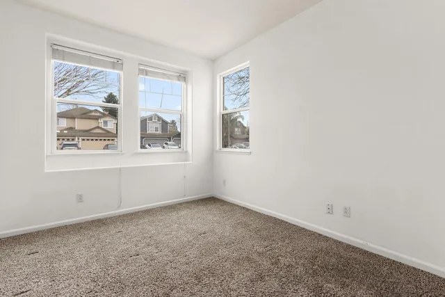 an empty room with wooden floor