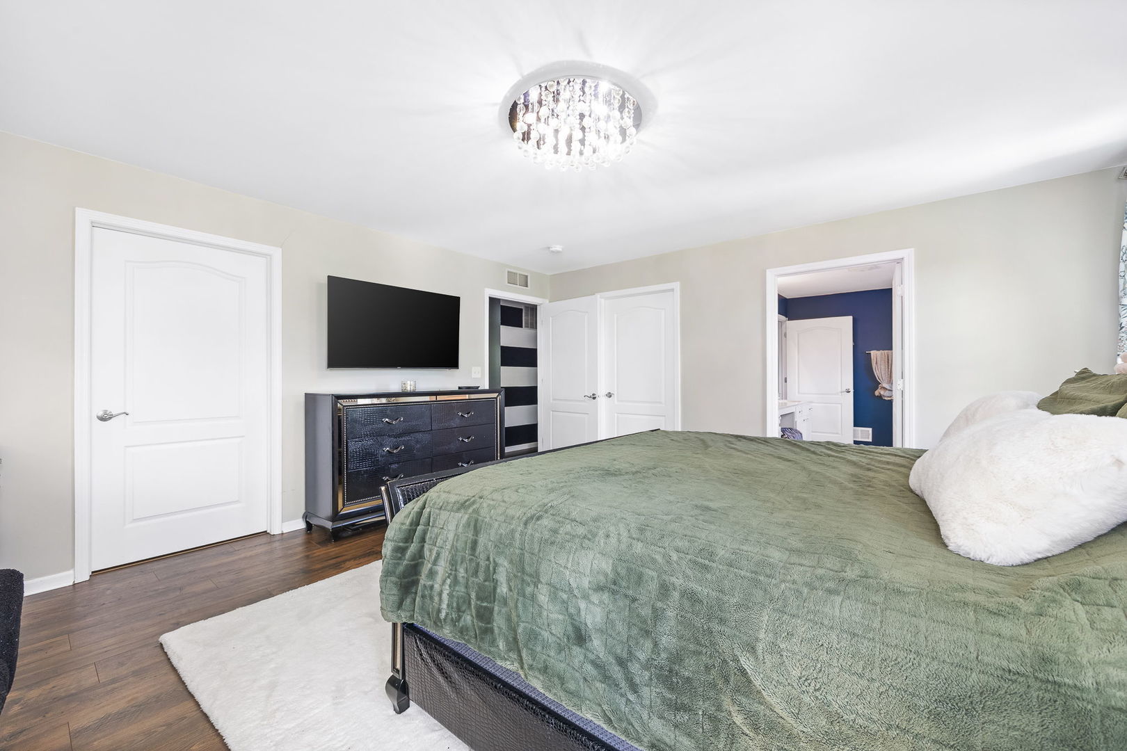 2297 Deerpath Road Bolingbrook, IL 60490 - Photo 20 of 46 a spacious bedroom with a bed and a flat screen tv
