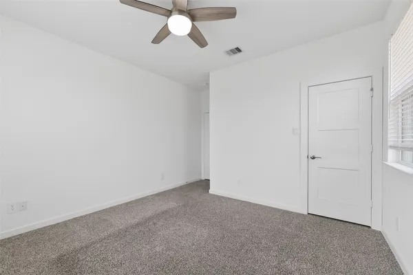 an empty room with fan