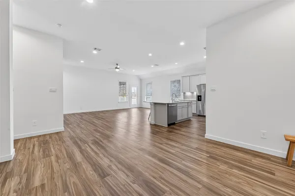 a view of kitchen and kitchen with wooden floor