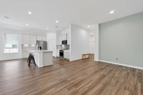 a view of kitchen with wooden floor