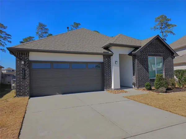 a front view of a house with a garage