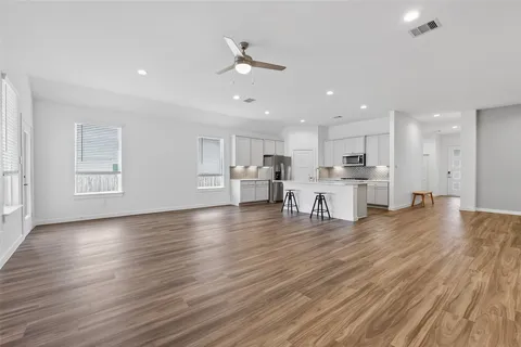 a view of kitchen with stainless steel appliances refrigerator microwave and stove
