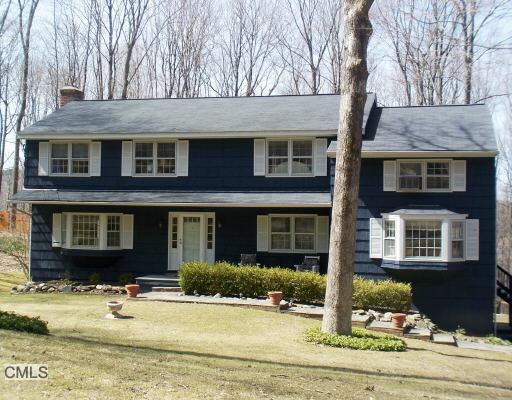 198 Mimosa Circle Ridgefield, CT 06877 - Photo 1 of 1 a front view of a house with garden