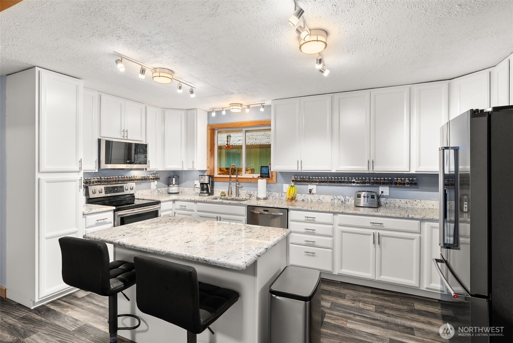 2434 Salzer Valley Road Centralia, WA 98531 - Photo 13 of 39 a kitchen with a sink a counter space appliances and cabinets